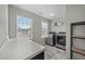 Laundry room equipped with stainless steel washer and dryer, plus a folding counter at 158 Arlie Ln, Lillington, NC 27546