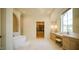 Luxurious bathroom features a freestanding tub, walk-in shower, and custom vanity at 1620 Hunting Ridge Rd, Raleigh, NC 27615