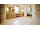 Stylish bathroom with double vanity, arched mirror, and elegant fixtures and finishes at 1620 Hunting Ridge Rd, Raleigh, NC 27615