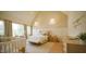 Comfortable bedroom featuring vaulted ceilings, neutral tones, and an abundance of natural light, ideal for relaxation at 1620 Hunting Ridge Rd, Raleigh, NC 27615
