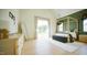 Bright bedroom showcasing a four-poster bed, ample natural light, and neutral decor, offering a serene retreat at 1620 Hunting Ridge Rd, Raleigh, NC 27615