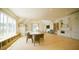 Spacious bonus room with dining area, built-in bookshelves, and ample seating, perfect for Gathering gatherings at 1620 Hunting Ridge Rd, Raleigh, NC 27615