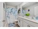 This bathroom boasts a double vanity, neutral paint, and stylish decor at 170 Lothian, Rocky Mount, NC 27804