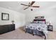 This primary bedroom offers neutral walls, carpet flooring, and a ceiling fan at 170 Lothian, Rocky Mount, NC 27804