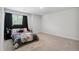 This secondary bedroom features neutral walls, carpet flooring, and a bright window at 170 Lothian, Rocky Mount, NC 27804