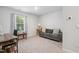 Bright bedroom with neutral carpet, a desk, and a comfortable couch for relaxing or studying at 170 Lothian, Rocky Mount, NC 27804
