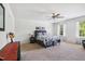 Spacious bedroom features a ceiling fan, natural light, and plush carpet for a comfortable retreat at 170 Lothian, Rocky Mount, NC 27804