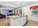 Open kitchen boasts granite countertops, stainless steel appliances and seamless flow into the living room at 170 Lothian, Rocky Mount, NC 27804