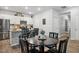 Eat-in kitchen with granite counters, stainless appliances, and a dark wood table at 170 Lothian, Rocky Mount, NC 27804