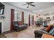 Comfortable living room boasts a fireplace, large windows, and plush seating, perfect for relaxation at 170 Lothian, Rocky Mount, NC 27804