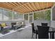 Inviting screened porch featuring comfortable seating, perfect for enjoying the outdoors. The space includes chairs and a table at 170 Lothian, Rocky Mount, NC 27804