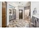 Spacious bathroom with walk-in shower, gray vanity and cabinets, plus decorative tile floors at 178 Greenwich Dr, Sanford, NC 27330