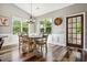 Dining room with many windows, a chandelier, wood flooring and six chairs at 178 Greenwich Dr, Sanford, NC 27330