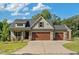Charming home with 3-car garage features a well-maintained lawn and a welcoming entrance at 178 Greenwich Dr, Sanford, NC 27330