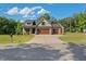 Charming home with a three-car garage, manicured lawn, and inviting curb appeal, perfect for a growing Gathering at 178 Greenwich Dr, Sanford, NC 27330