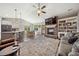 Open-concept living room with fireplace, hardwood floors, and an inviting atmosphere at 178 Greenwich Dr, Sanford, NC 27330