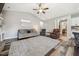 Bright living room with vaulted ceilings, wood floors, and cozy furniture arrangement at 178 Greenwich Dr, Sanford, NC 27330