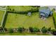 Large backyard with lush lawn, shed, privacy trees, and rear house view at 192 Waterpine Dr, Garner, NC 27529