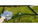 Expansive backyard with lush greenery, garden, shed, and privacy trees at 192 Waterpine Dr, Garner, NC 27529