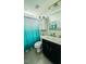 Bathroom featuring a shower with tub, a toilet, a sink with vanity, and decorative mirror at 192 Waterpine Dr, Garner, NC 27529