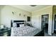 Bedroom with ensuite bathroom, dark accents, and neutral-toned walls at 192 Waterpine Dr, Garner, NC 27529