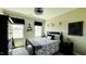 Bedroom with two windows and black and white bedding at 192 Waterpine Dr, Garner, NC 27529