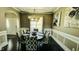 Dining room features stylish chairs, dark hardwood floors, and decorative lighting at 192 Waterpine Dr, Garner, NC 27529