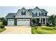 Charming two-story home with a well-manicured lawn and three-car garage at 192 Waterpine Dr, Garner, NC 27529