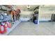 Neat garage with epoxy floors and organized tool and supply storage at 192 Waterpine Dr, Garner, NC 27529