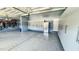 Spacious garage with epoxy flooring, lots of storage and refrigerator at 192 Waterpine Dr, Garner, NC 27529