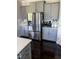 The kitchen features stainless steel appliances, ample counter space, and gray cabinetry at 192 Waterpine Dr, Garner, NC 27529