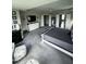 Spacious primary bedroom featuring tray ceilings, dual walk-in closets, and a sitting area at 192 Waterpine Dr, Garner, NC 27529
