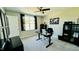 Bright office featuring a modern black desk, shelving and a ceiling fan at 192 Waterpine Dr, Garner, NC 27529