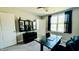 A dedicated office area features a modern desk, black storage and a window at 192 Waterpine Dr, Garner, NC 27529