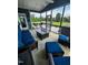 Inviting screened-in patio with lounge seating and outdoor dining area, and backyard view at 192 Waterpine Dr, Garner, NC 27529