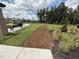 Tranquil community park and green space with walking trail, bench seating, and picnic area at 2106 Pink Peony Cir # 146, Durham, NC 27703