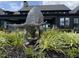 Eye-catching stainless steel sculpture of a grazing animal in front of modern black home at 2106 Pink Peony Cir # 146, Durham, NC 27703
