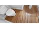Bright bathroom featuring a toilet and hardwood floors at 2408 Tiltonshire Ln, Apex, NC 27539