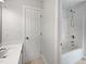 Clean, well-lit bathroom features a tub and shower at 2408 Tiltonshire Ln, Apex, NC 27539