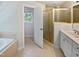 Bathroom with a separate shower and soaking tub at 2408 Tiltonshire Ln, Apex, NC 27539