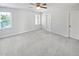 Spacious, carpeted bedroom with multiple windows, and ample natural light at 2408 Tiltonshire Ln, Apex, NC 27539