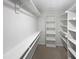 Walk-in closet with shelving and carpeted floor at 2408 Tiltonshire Ln, Apex, NC 27539
