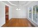 Dining room with hardwood flooring, natural light, and classic design at 2408 Tiltonshire Ln, Apex, NC 27539