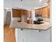 Open kitchen design with bar seating and easy access to other living spaces at 2408 Tiltonshire Ln, Apex, NC 27539