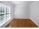 Office/bedroom featuring hardwood floors and natural light at 2408 Tiltonshire Ln, Apex, NC 27539