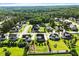Expansive aerial shot of a lovely neighborhood with well-manicured lawns and beautiful homes surrounded by lush trees at 241 Teague St, Wake Forest, NC 27587
