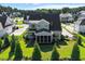 Aerial view of home featuring a screened-in porch overlooking verdant, tree-lined backyard at 241 Teague St, Wake Forest, NC 27587
