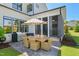 Backyard patio with an outdoor dining table and chairs, plus an umbrella, and a grill at 241 Teague St, Wake Forest, NC 27587
