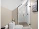 Bathroom featuring a glass shower door, subway tile, and a neutral color palette at 241 Teague St, Wake Forest, NC 27587