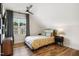 Cozy bedroom with a large window, ceiling fan, wood floors and neutral paint at 241 Teague St, Wake Forest, NC 27587